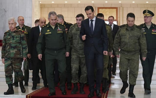 אסד בפגישה עם שר ההגנה הרוסי, מרץ 2020 (צילום: SANA via A)
