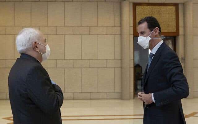 אסד בפגישה עם השר החוץ האיראני (צילום: SANA via AP)
