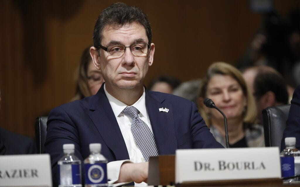 FILE – In this Feb. 26, 2019 file photo, Albert Bourla, chief executive officer of Pfizer, prepares to testify before the Senate Finance Committee hearing on drug prices, on Capitol Hill in Washington. Bourla urged global governments not to reopen economies too quickly because of the optimism created by possible COVID-19 vaccines. He says the vaccine is one tool in controlling the disease. Bourla was speaking Wednesday, Dec. 2, 2020, during an online event hosted in his native Greece. (AP Photo/Pablo Martinez Monsivais, File) (צילום: AP Photo/Pablo Martinez Monsivais)