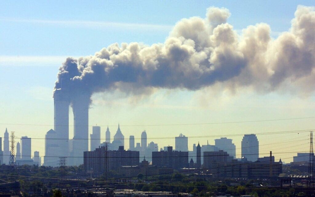 FILE - In this Sept. 11, 2001 file photo, as seen from the New Jersey Turnpike near Kearny, N.J., smoke billows from the twin towers of the World Trade Center in New York after airplanes crashed into both towers. Families of the victims of the worst terror attack on the United States in history gathered Wednesday, Sept. 11, 2013, to mark their 12th anniversary with a moment of silence and the reading of names. The Sept. 11, 2001 attacks in New York City and Washington killed almost 3,000 people and lead to a war in Afghanistan. (AP Photo/Gene Boyars) FILE - In this Sept. 11, 2001 file photo, as seen from the New Jersey Turnpike near Kearny, N.J., smoke billows from the twin towers of the World Trade Center in New York after airplanes crashed into both towers. Families of the victims of the worst terror attack on the United States in history gathered Wednesday, Sept. 11, 2013, to mark their 12th anniversary with a moment of silence and the reading of names. The Sept. 11, 2001 attacks in New York City and Washington killed almost 3,000 people and lead to a war in Afghanistan. (AP Photo/Gene Boyars)