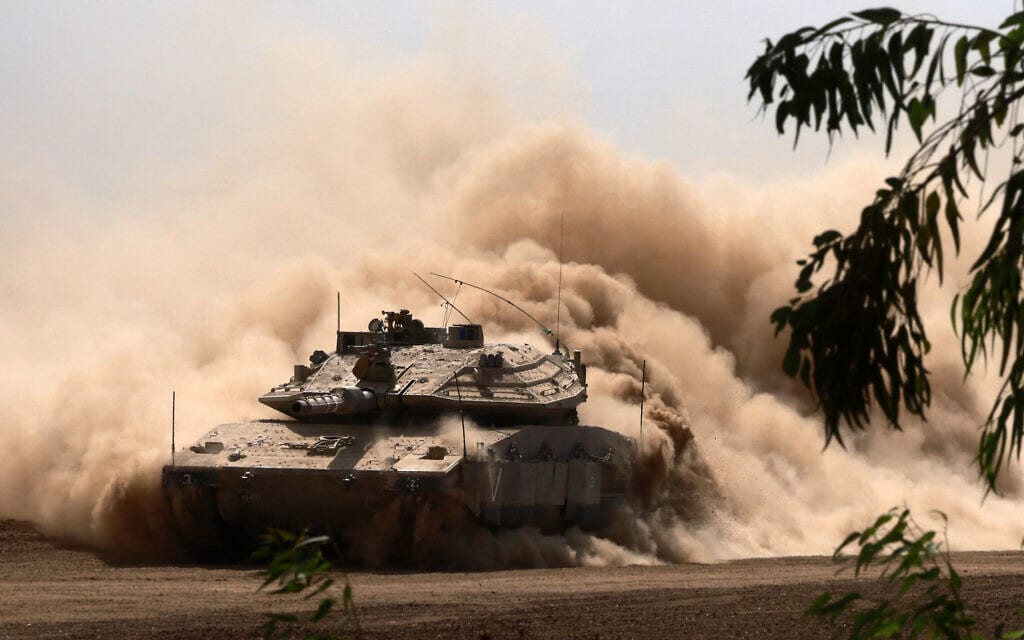 טנק ישראלי באזור הגבול עם עזה, 13 באוקטובר 2023 (צילום: Menahem KAHANA / AFP)