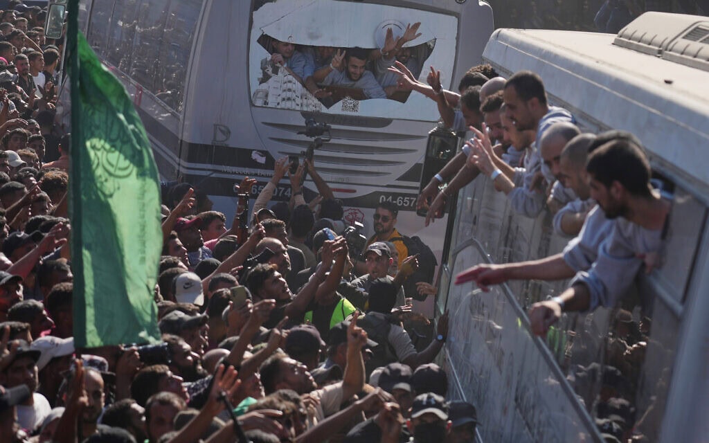 People gather to greet freed Palestinian prisoners arriving on buses in the Gaza Strip after their release from Israeli jails under a ceasefire agreement between Hamas and Israel, outside Nasser Hospital in Khan Younis, southern Gaza Strip, Monday, Oct. 13, 2025. (AP Photo/Jehad Alshrafi) People gather to greet freed Palestinian prisoners arriving on buses in the Gaza Strip after their release from Israeli jails under a ceasefire agreement between Hamas and Israel, outside Nasser Hospital in Khan Younis, southern Gaza Strip, Monday, Oct. 13, 2025. (AP Photo/Jehad Alshrafi)