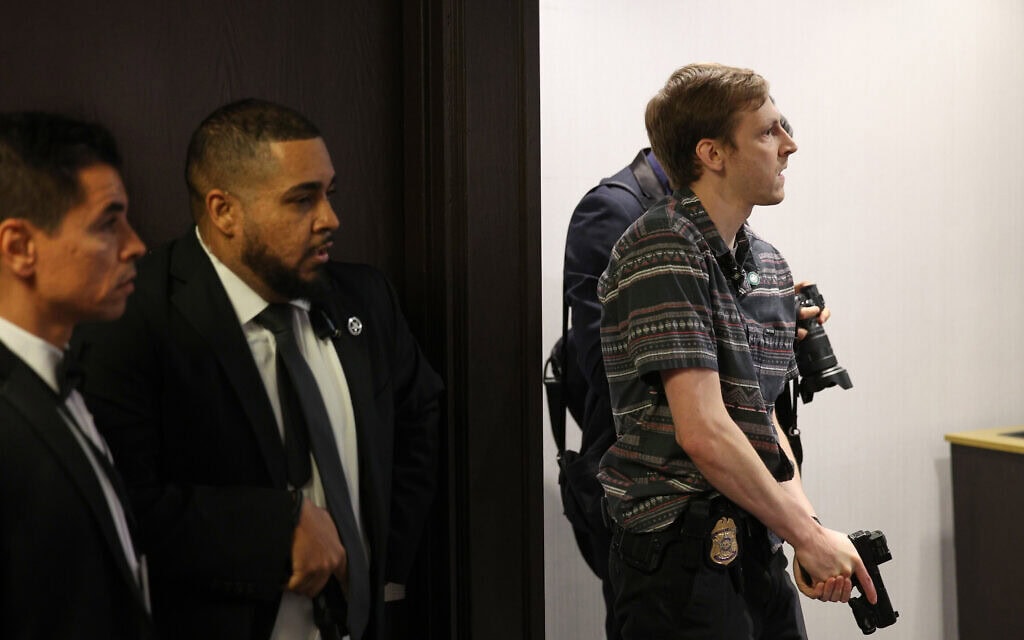 Members of law enforcement respond during the White House Correspondents Dinner, Saturday, April 25, 2026, in Washington. (AP Photo/Tom Brenner)